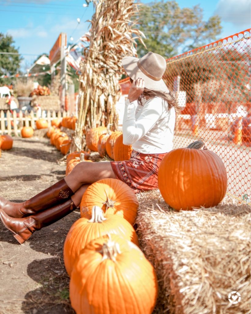 Top US Blog, The Pink Patola wearing a Zara sweater, Tory Burch Riding Boots, and Embroidered Skirt from Franchesca's Collection for a cute yet comfy pumpkin patch look | Fall 2020 outfits, fall 2020 activities, corn field, what to wear to a cornfield pumpkin patch